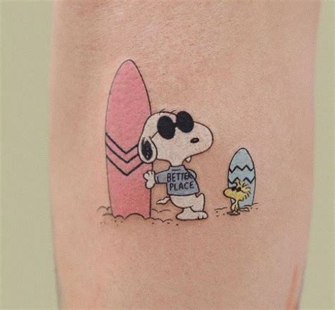 snoopy tattoo|snoopy forearm tattoo.